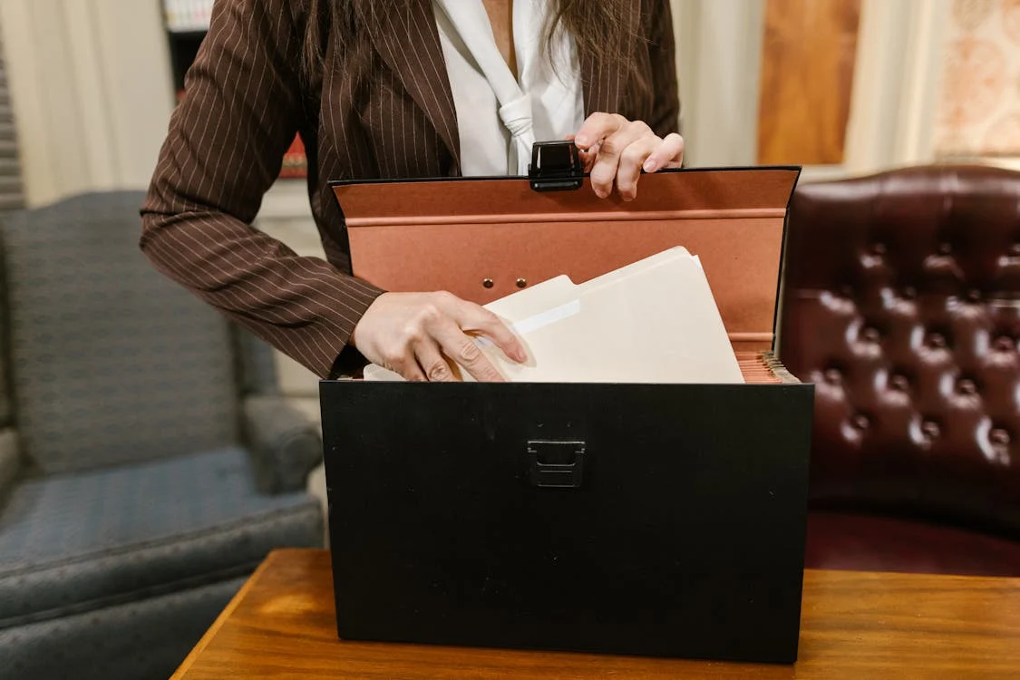 personal injury lawyer reaching for documents in briefcase