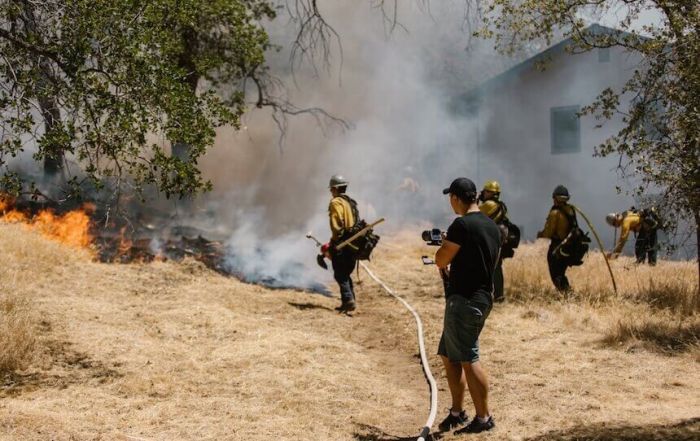 fire crew battling wildfire outside home