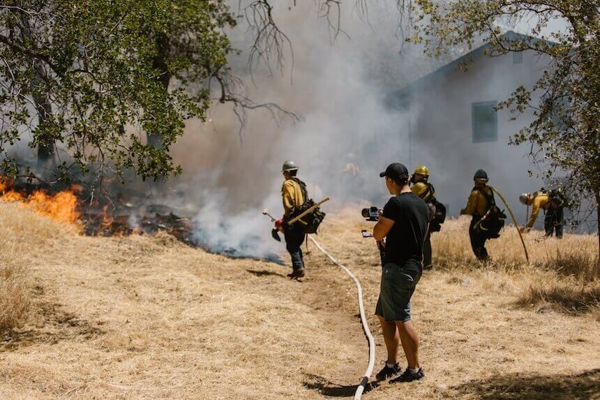 fire crew battling wildfire outside home