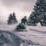 person riding snowmobile through deep snow